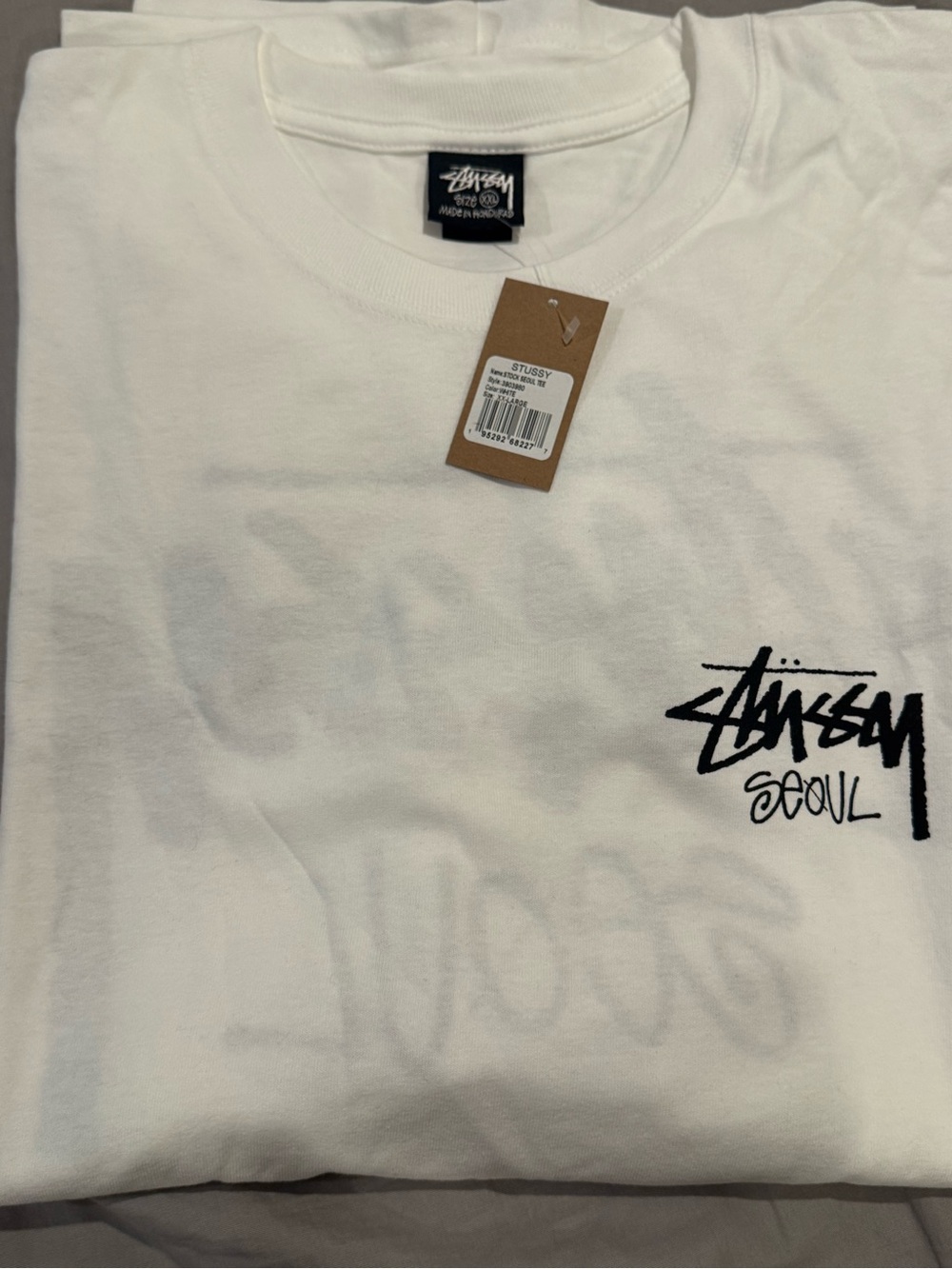 Stussy White Short Sleeve T-Shirt with Black Seoul Logo